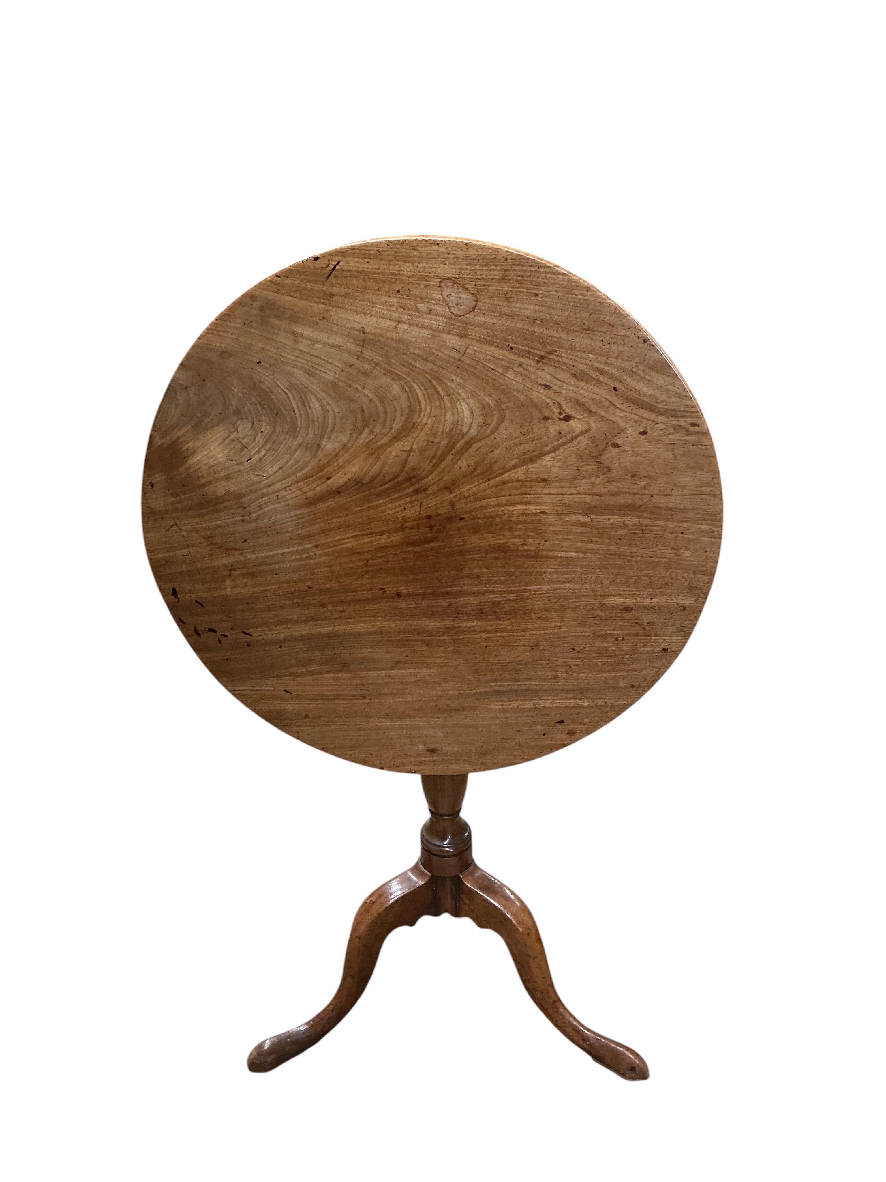 An early 19th century circular mahogany tilt top tripod tea table, diameter 59cm, height 71cm, together with an oak oval occasional table, adapted
